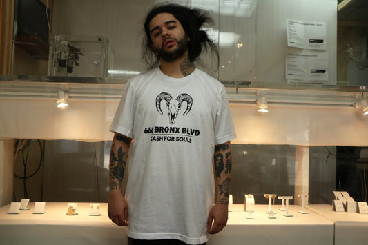 V4 New York Model wearing cash for souls t-shirt in a pawn shop in the Bronx