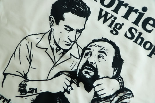 Illustration of a man getting strangled with text 'Morrie Wig Shop' (Robert Dinero from Goodfellas)